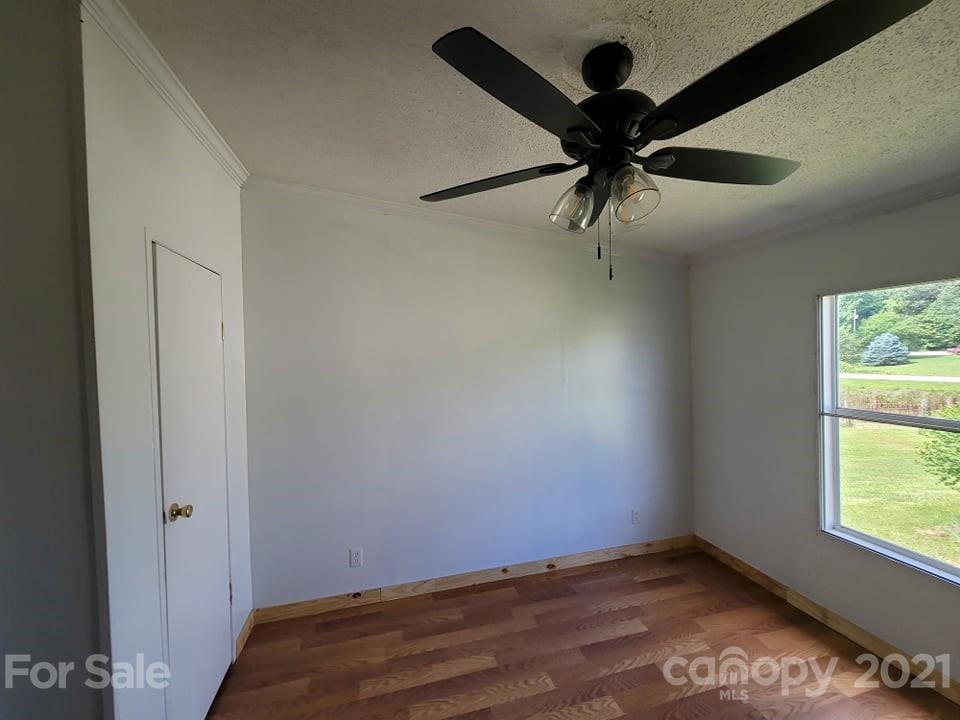 525 Baker Mill Road Cleveland, NC 27013 - Photo 32 of 35 wooden floor in an empty room with a window
