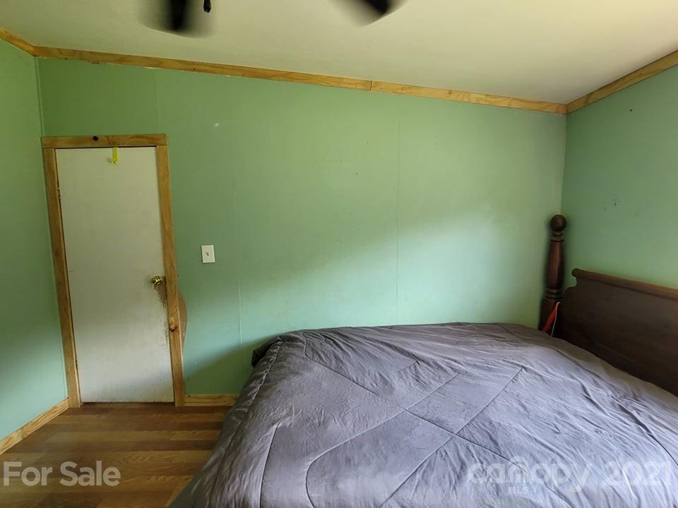 525 Baker Mill Road Cleveland, NC 27013 - Photo 34 of 35 a bedroom with a bed and a table
