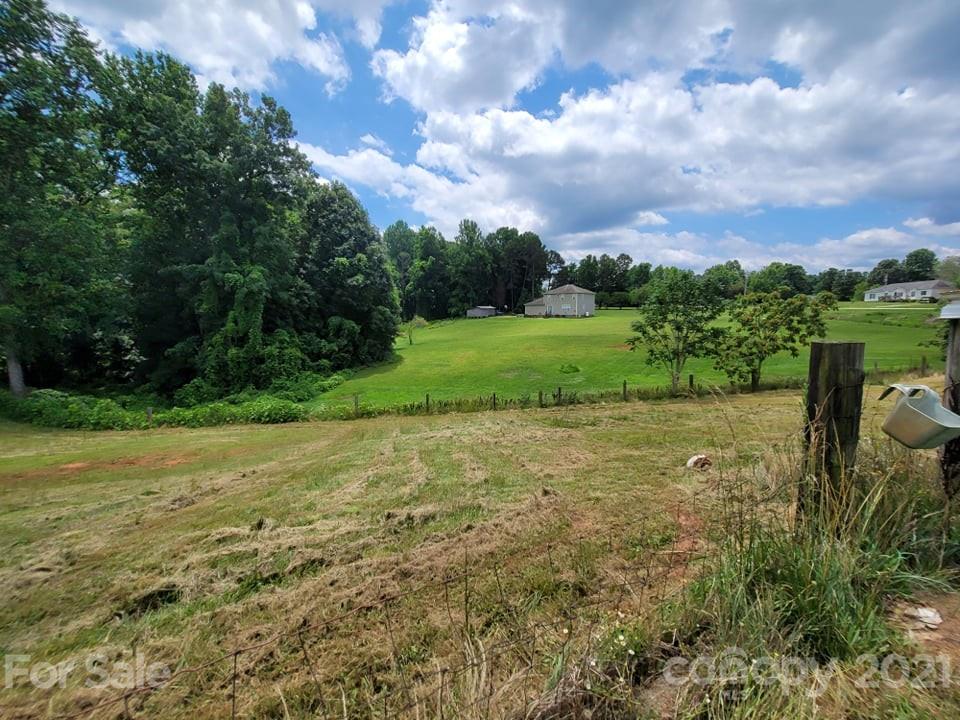 525 Baker Mill Road Cleveland, NC 27013 - Photo 10 of 35 a view of a field with an trees