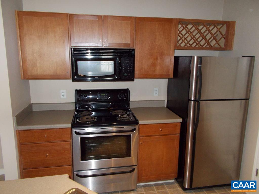 720 Walker Square, Unit 3D Charlottesville, VA 22903 - Photo 11 of 26 a kitchen with a stove and a microwave