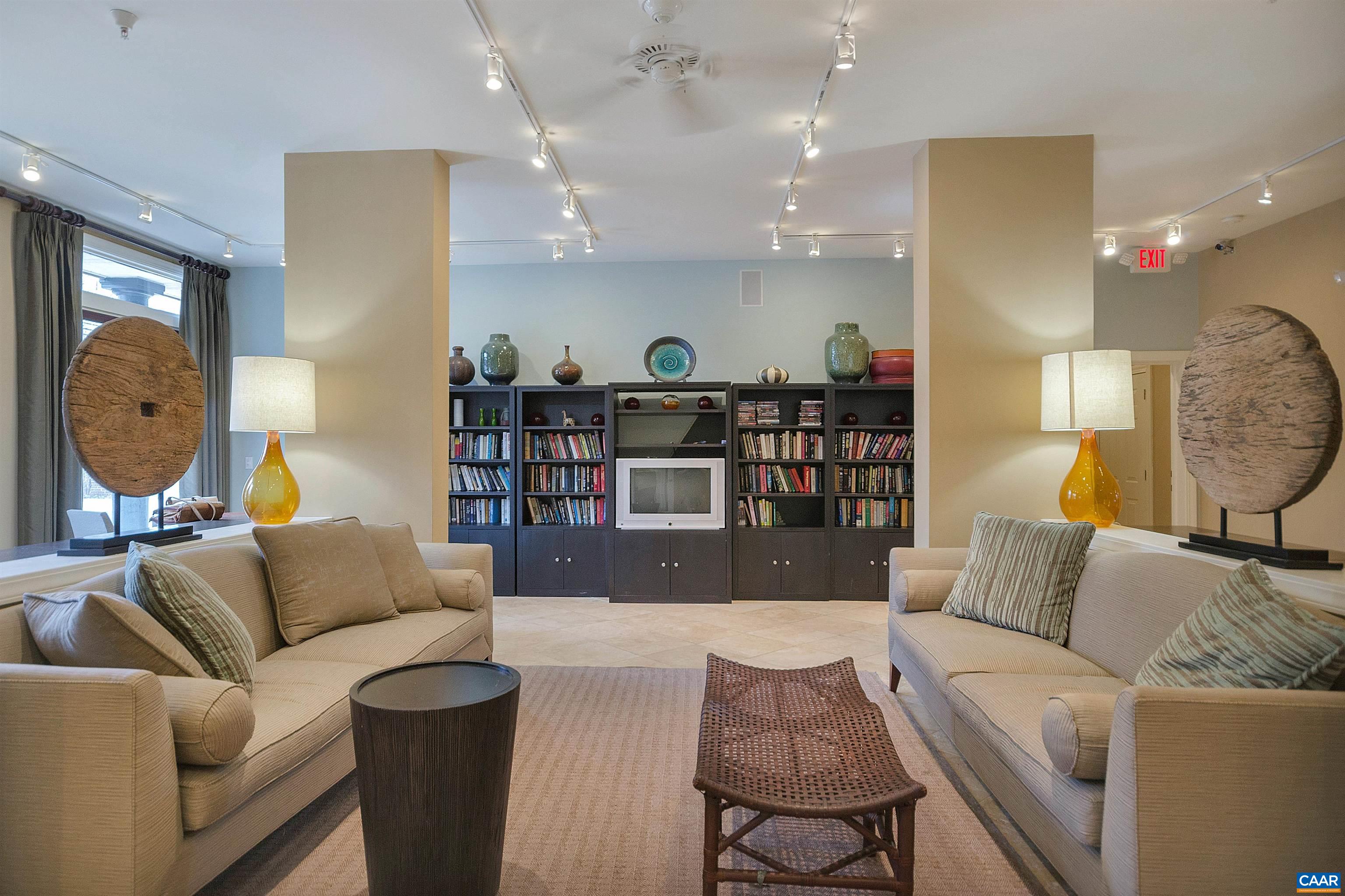 720 Walker Square, Unit 3D Charlottesville, VA 22903 - Photo 14 of 26 a living room with furniture and a wooden floor
