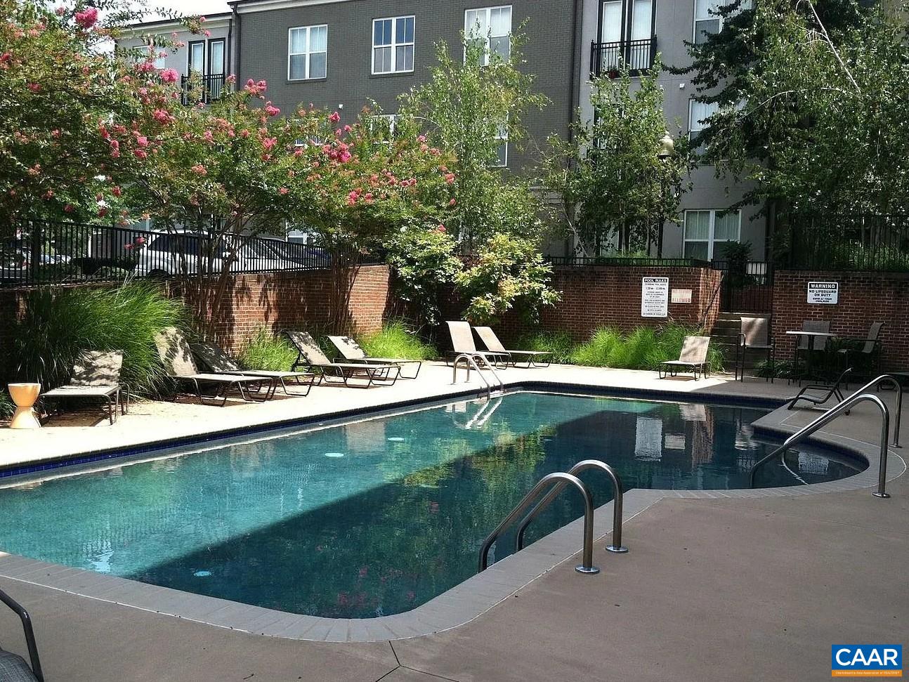 720 Walker Square, Unit 3D Charlottesville, VA 22903 - Photo 19 of 26 a view of a swimming pool with a patio and a yard