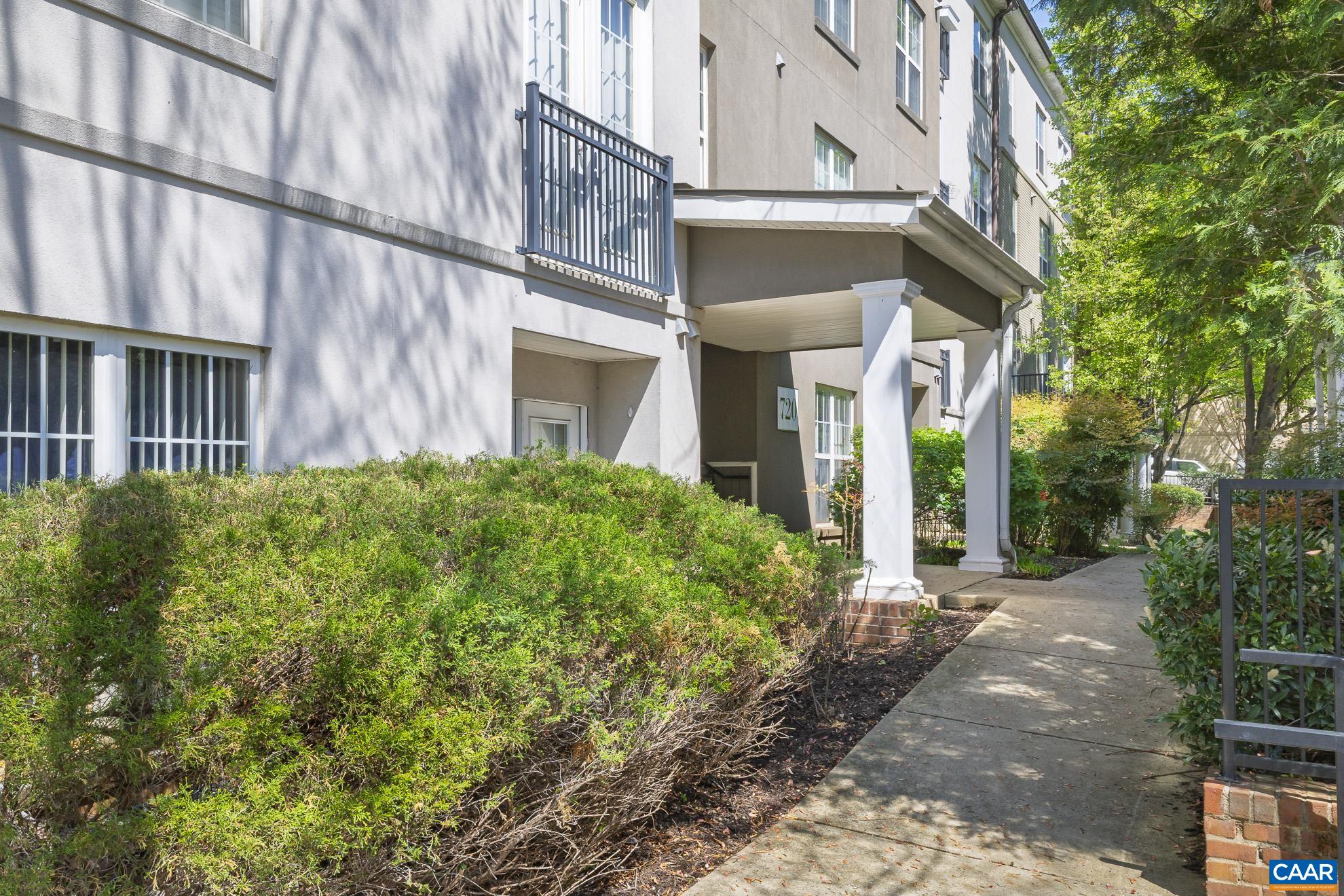 720 Walker Square, Unit 3D Charlottesville, VA 22903 - Photo 3 of 26 a view of a building with a yard