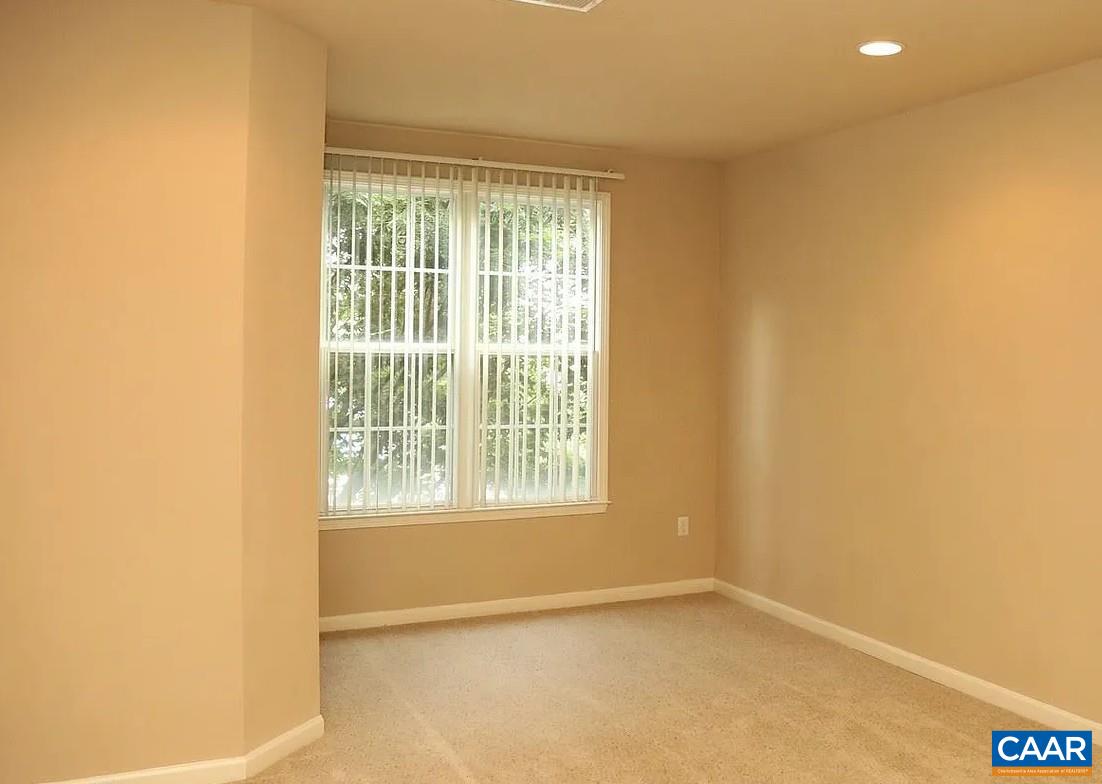720 Walker Square, Unit 3D Charlottesville, VA 22903 - Photo 7 of 26 a view of an empty room with a window