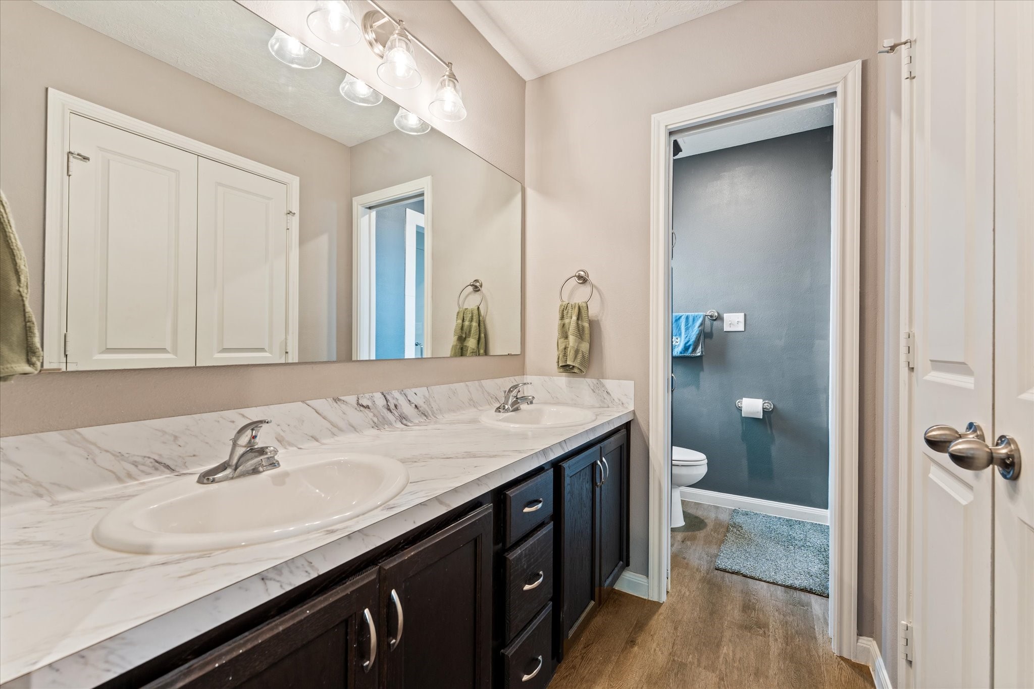 3998 Frontier Road Willis, TX 77378 - Photo 12 of 33 a bathroom with a sink a vanity and a mirror