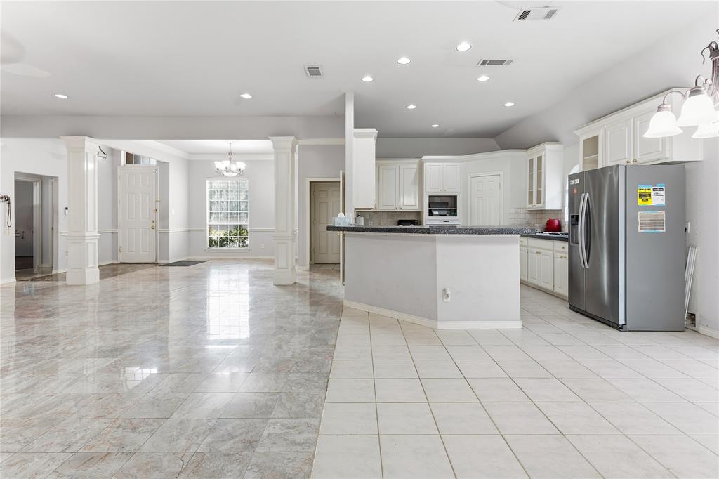 2505 Timber Ridge Drive Garland, TX 75044 - Photo 11 of 38 a large kitchen with stainless steel appliances lots of counter top space