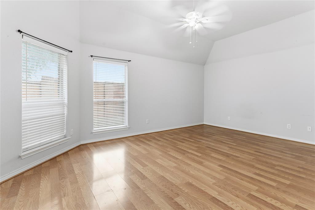 2505 Timber Ridge Drive Garland, TX 75044 - Photo 18 of 38 wooden floor in an empty room with a window