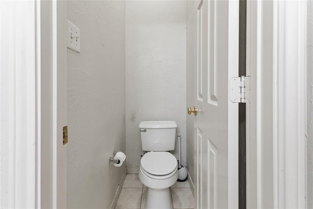 2505 Timber Ridge Drive Garland, TX 75044 - Photo 22 of 38 a white toilet sitting next to a white walls