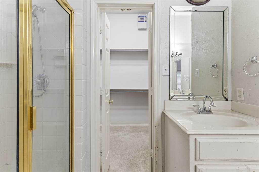 2505 Timber Ridge Drive Garland, TX 75044 - Photo 24 of 38 a bathroom with a sink and a mirror