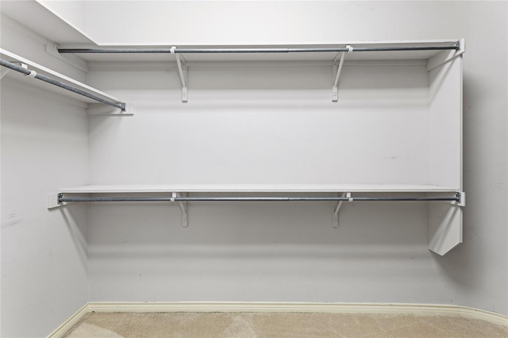 2505 Timber Ridge Drive Garland, TX 75044 - Photo 25 of 38 a view of an empty walk in closet
