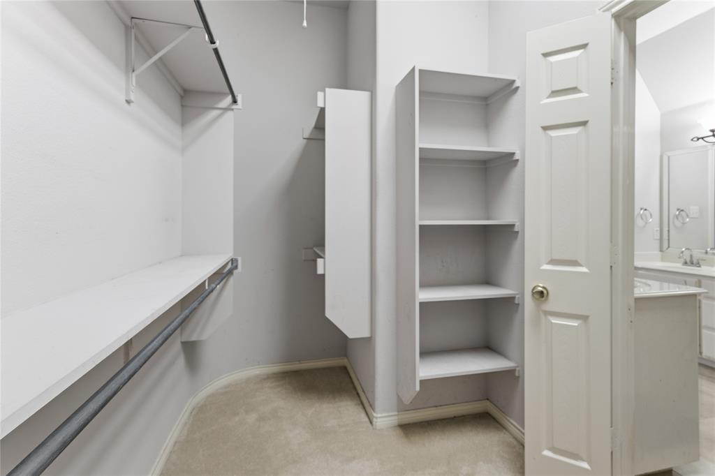 2505 Timber Ridge Drive Garland, TX 75044 - Photo 26 of 38 a view of an empty walk in closet