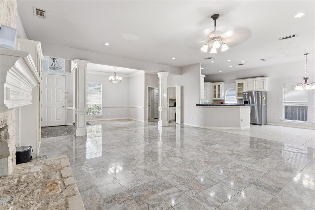 2505 Timber Ridge Drive Garland, TX 75044 - Photo 27 of 38 a view of a kitchen with a refrigerator and a sink