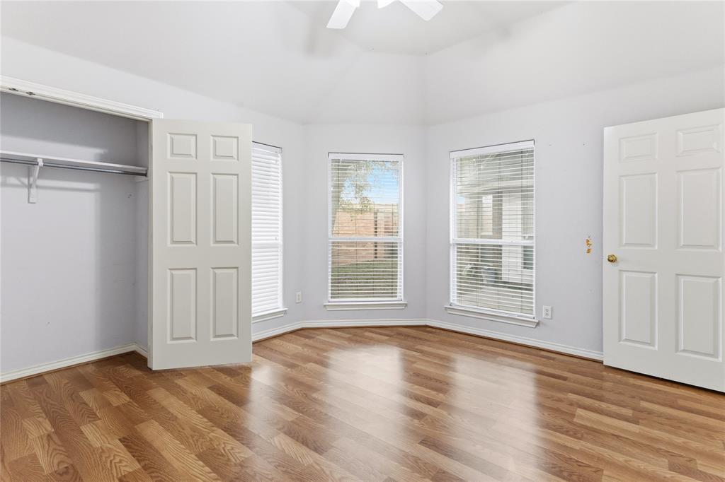 2505 Timber Ridge Drive Garland, TX 75044 - Photo 28 of 38 a view of an empty room with wooden floor and a window