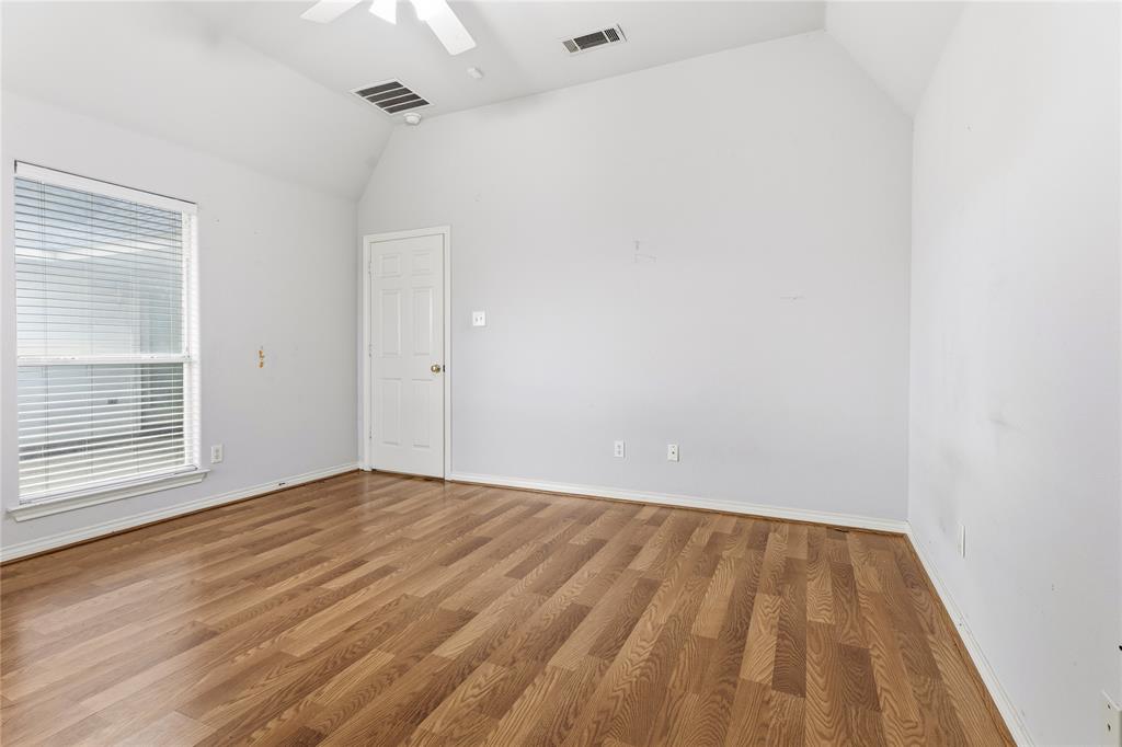 2505 Timber Ridge Drive Garland, TX 75044 - Photo 30 of 38 a view of an empty room with wooden floor and a window