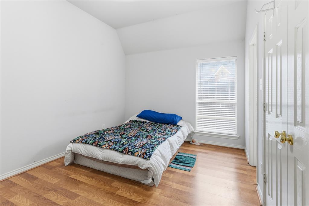 2505 Timber Ridge Drive Garland, TX 75044 - Photo 37 of 38 a room with a bed and a window