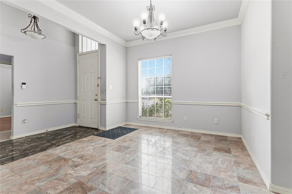 2505 Timber Ridge Drive Garland, TX 75044 - Photo 5 of 38 a view of an empty room with a window