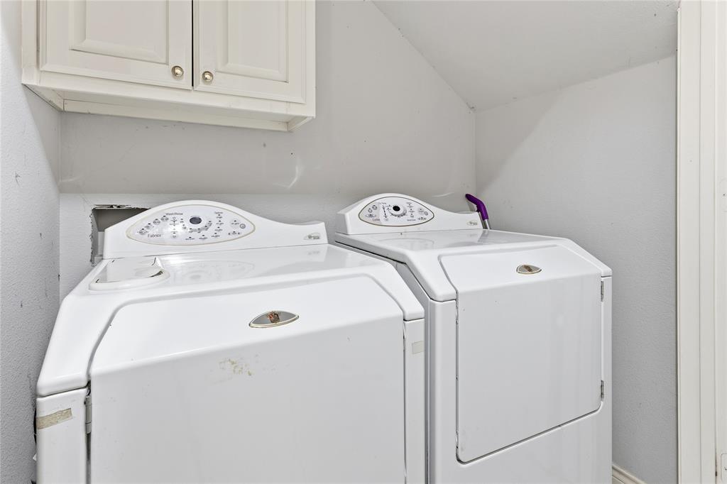 2505 Timber Ridge Drive Garland, TX 75044 - Photo 8 of 38 a utility room with dryer and washer