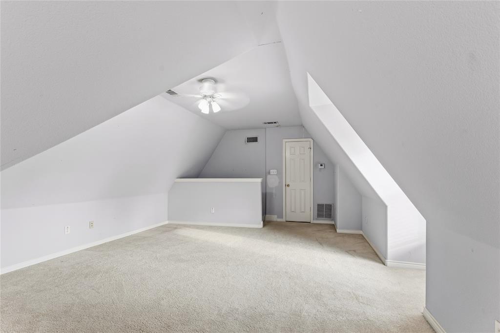 2505 Timber Ridge Drive Garland, TX 75044 - Photo 10 of 38 a view of a big room with closet and windows