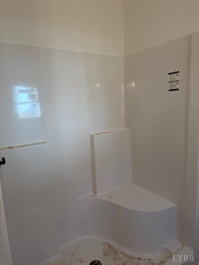 689 Robinson Road Appomattox, VA 24522 - Photo 10 of 16 a close up of a bathtub in a bathroom