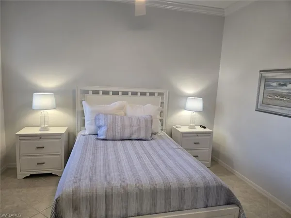 a bed room with a bed and a night stand
