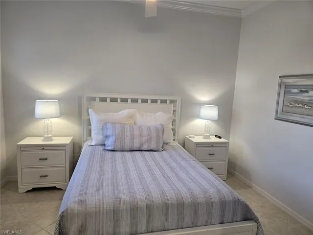 a bed room with a bed and a night stand