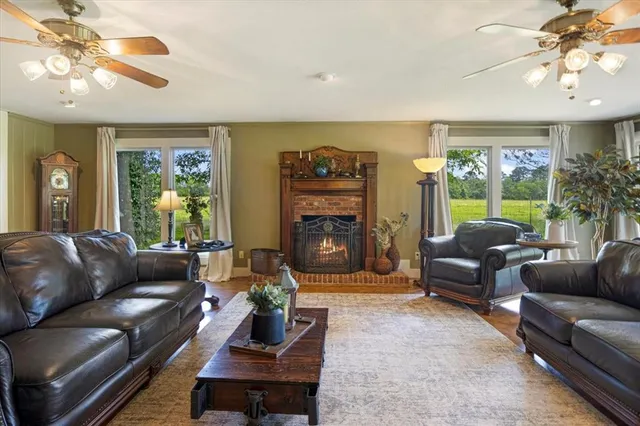 a living room with furniture and a fireplace