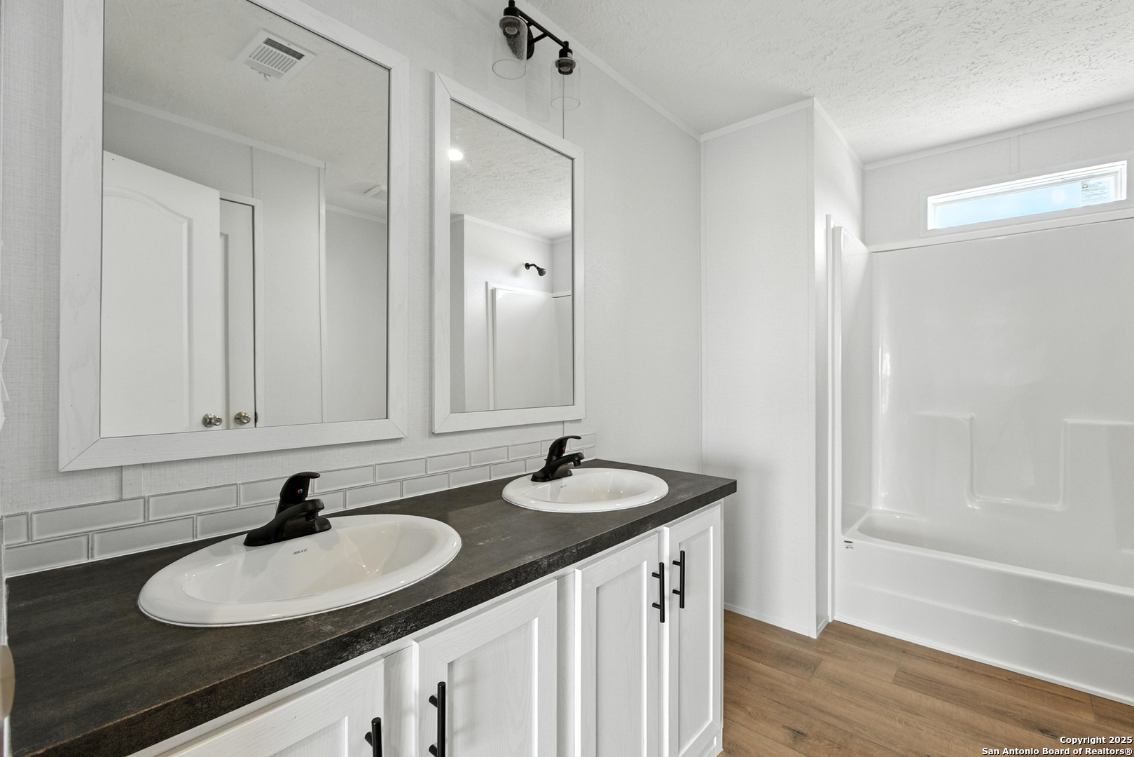 2479 Fm 1332 Jourdanton, TX 78026 - Photo 12 of 18 a bathroom with double sink and a mirror