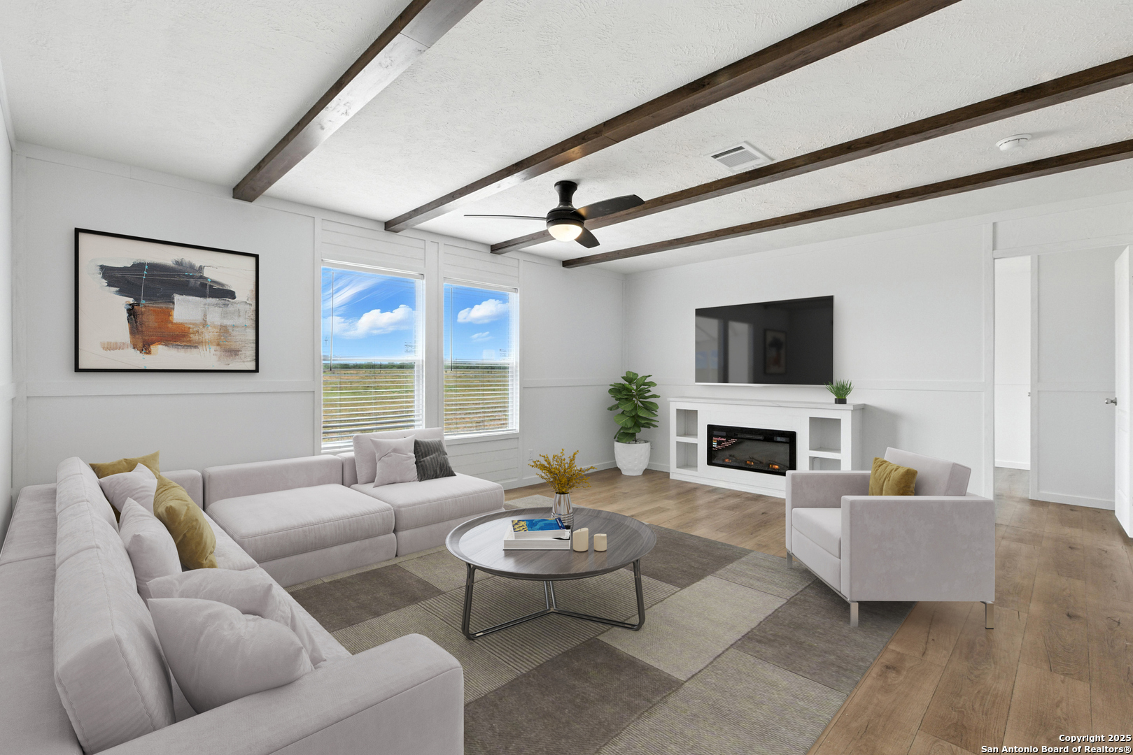 2479 Fm 1332 Jourdanton, TX 78026 - Photo 10 of 18 a living room with furniture a fireplace and a flat screen tv