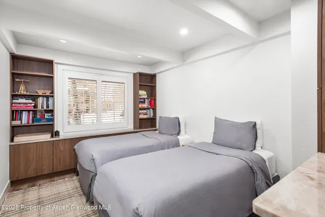 a bedroom with a large bed and a closet