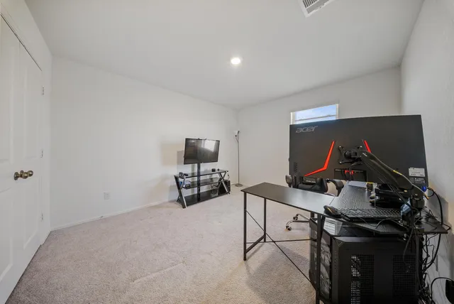 a view of a workspace with furniture