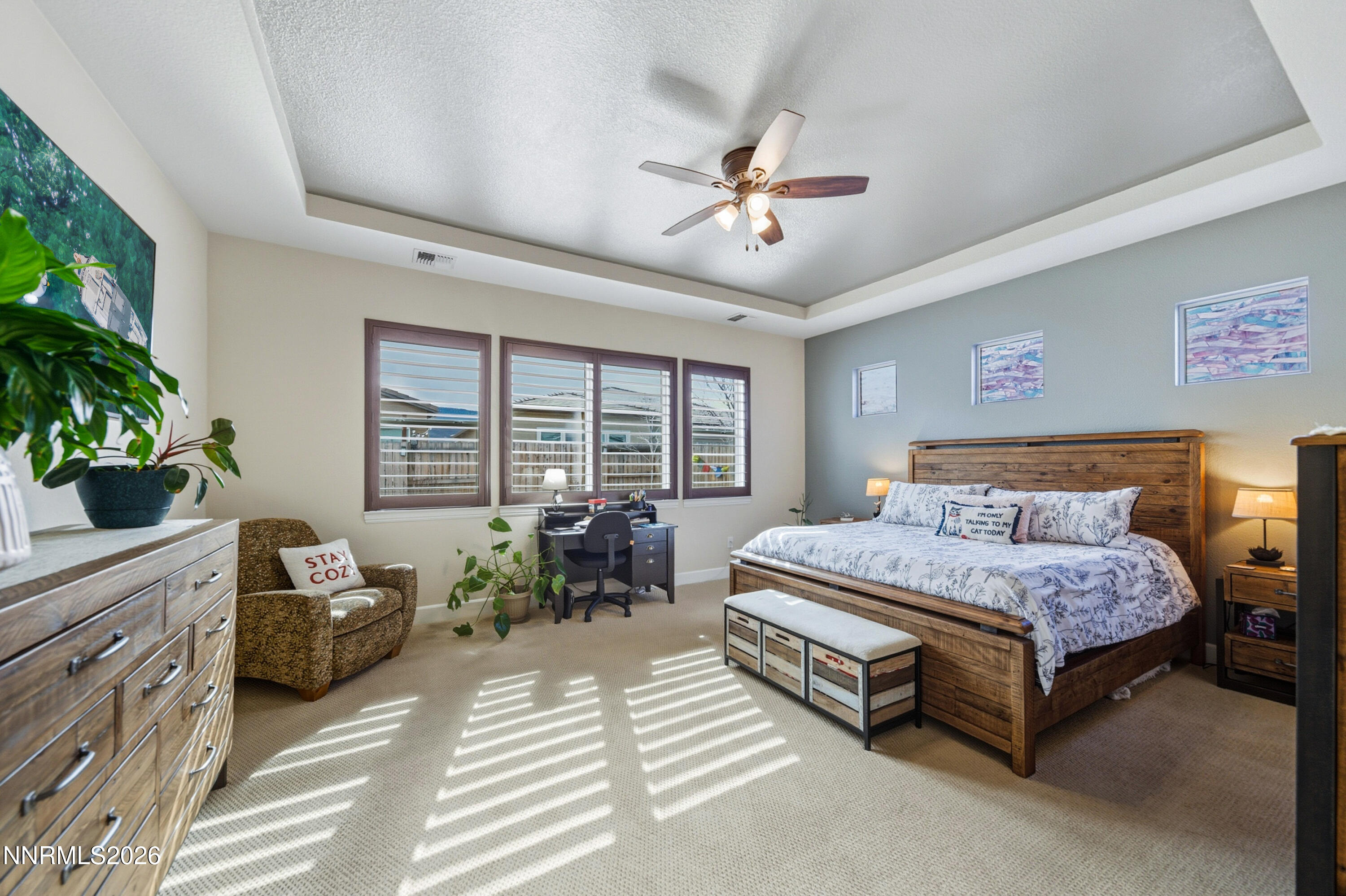 2468 Sparstone Drive Reno, NV 89521 - Photo 15 of 39 a spacious bedroom with a bed and a chandelier