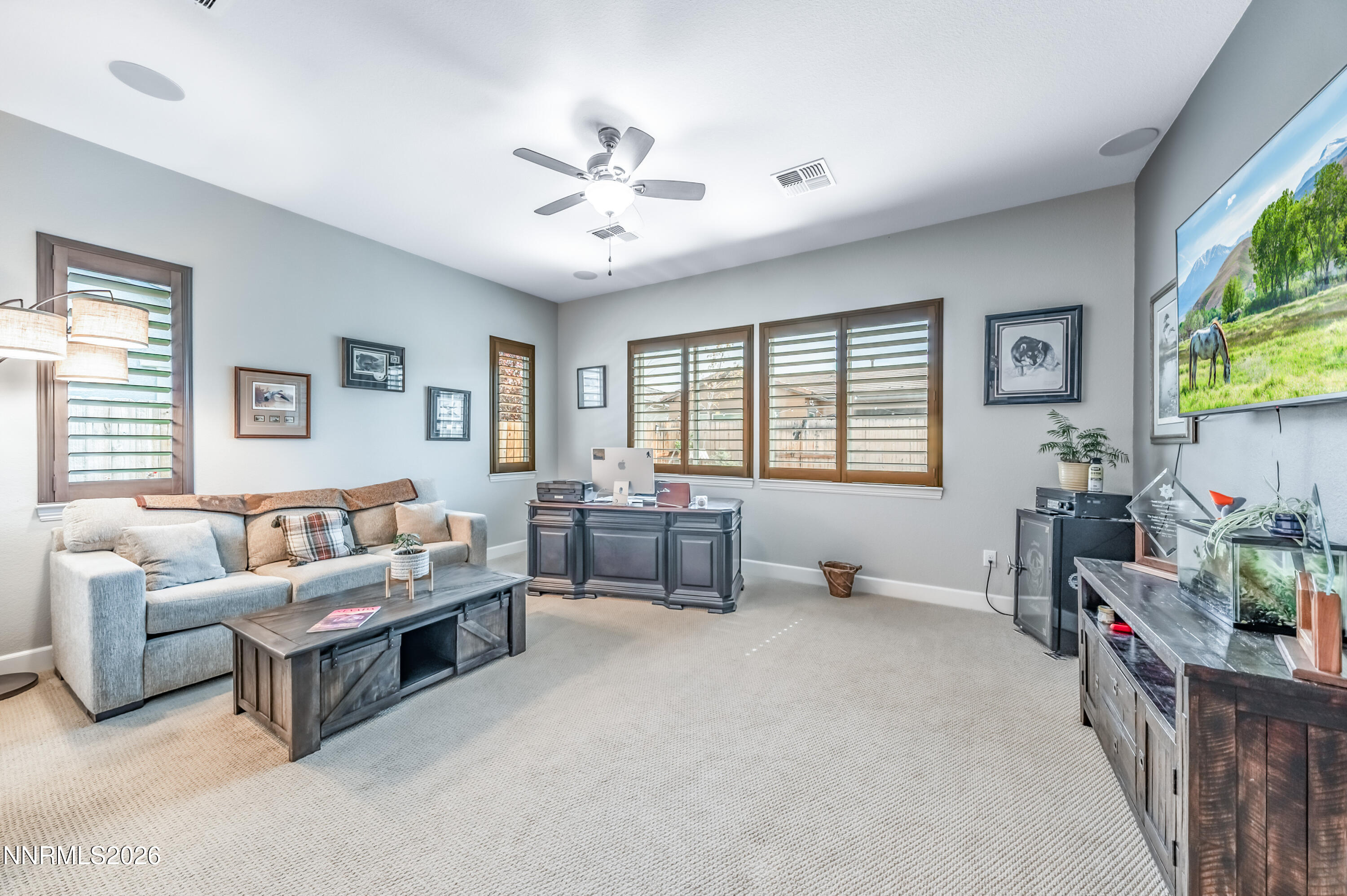 2468 Sparstone Drive Reno, NV 89521 - Photo 21 of 39 a living room with furniture and a flat screen tv