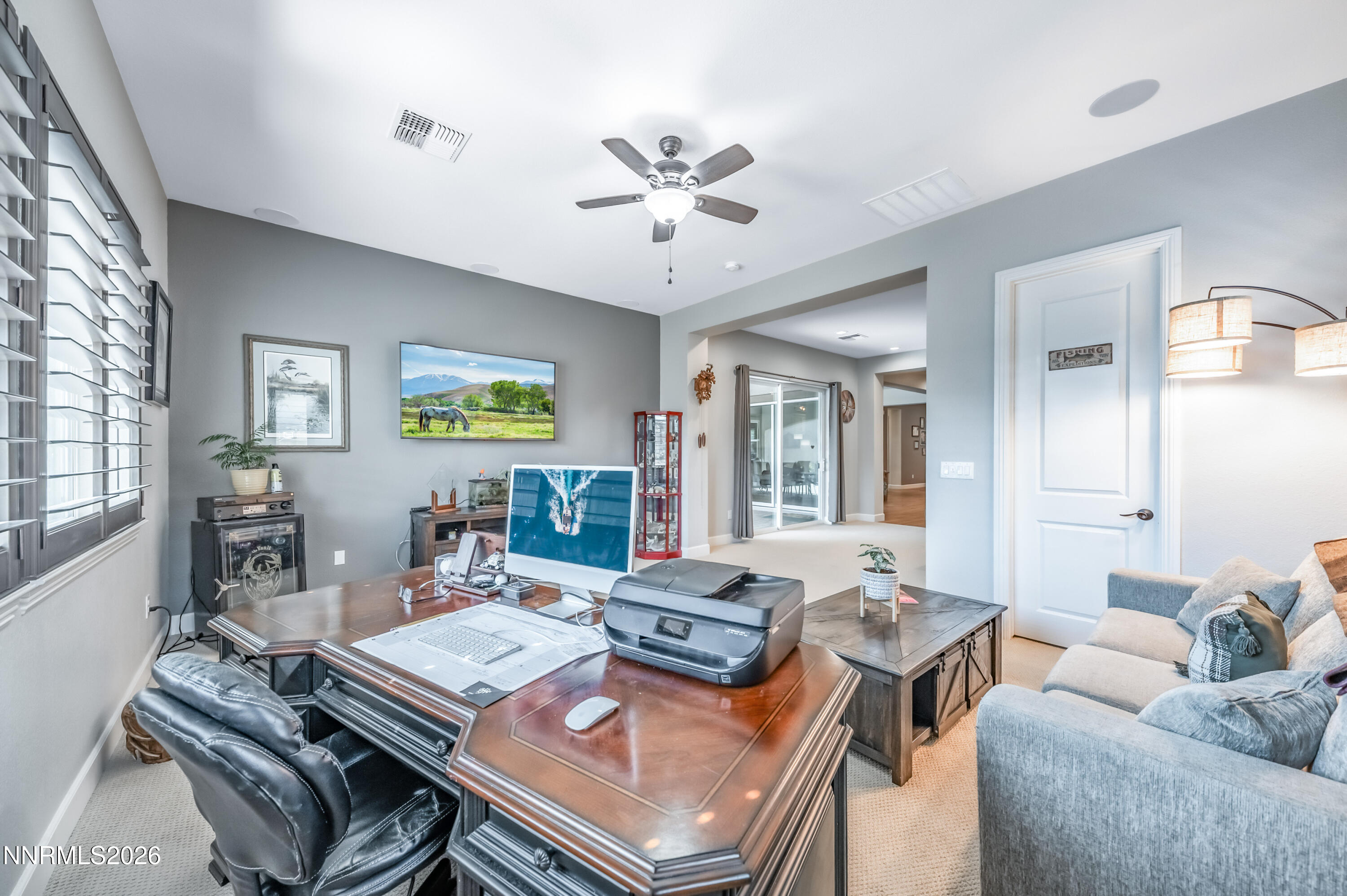 2468 Sparstone Drive Reno, NV 89521 - Photo 22 of 39 a living room with furniture and a chandelier