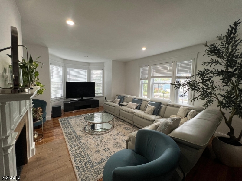 865 Westfield Avenue Elizabeth, NJ 07208 - Photo 13 of 26 a living room with furniture and a flat screen tv