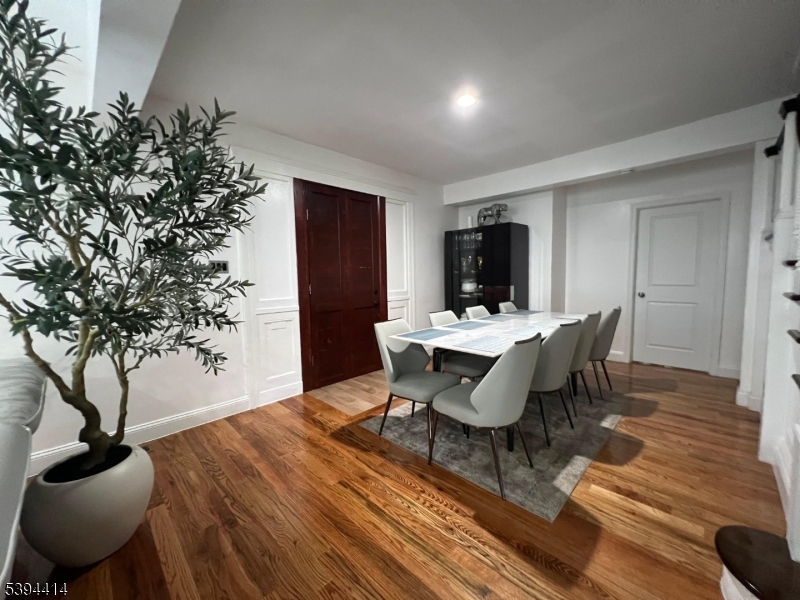 865 Westfield Avenue Elizabeth, NJ 07208 - Photo 15 of 26 a dining room with furniture and wooden floor