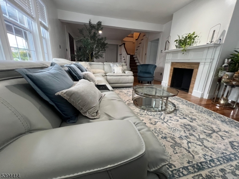 865 Westfield Avenue Elizabeth, NJ 07208 - Photo 19 of 26 a living room with furniture and a fireplace
