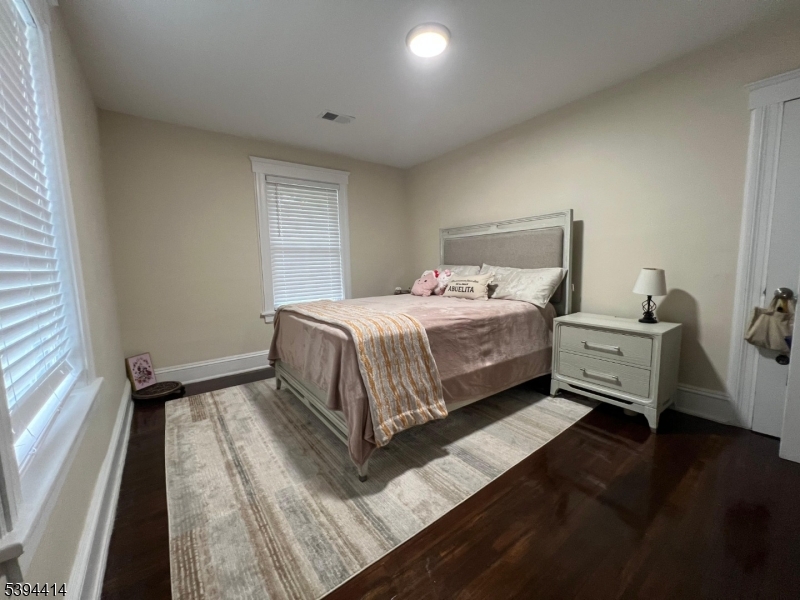 865 Westfield Avenue Elizabeth, NJ 07208 - Photo 21 of 26 a bedroom with a bed and a large window