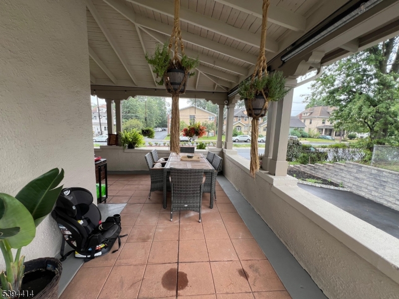 865 Westfield Avenue Elizabeth, NJ 07208 - Photo 7 of 26 a living room with patio furniture and a patio