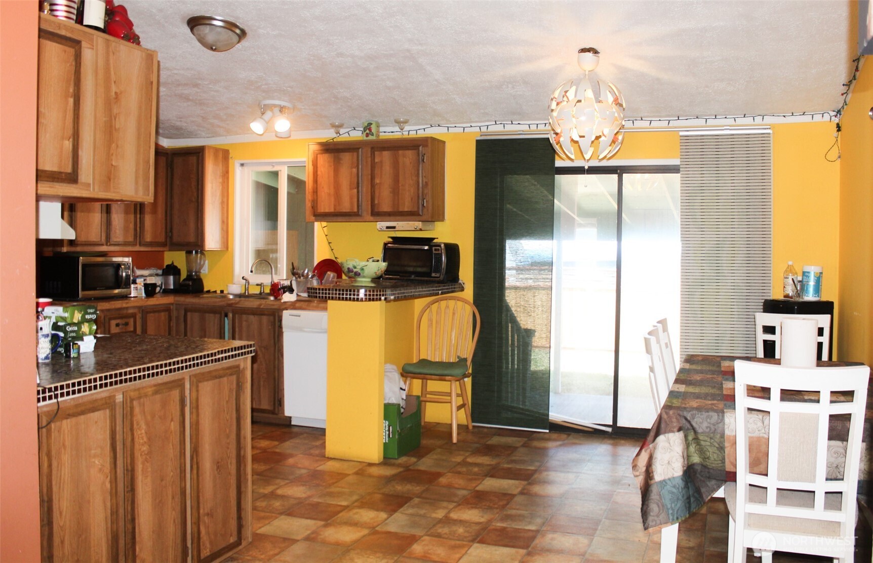 5705 Littlerock Road Southwest, Unit 41 Tumwater, WA 98512 - Photo 11 of 18 a kitchen with stainless steel appliances a refrigerator and cabinets