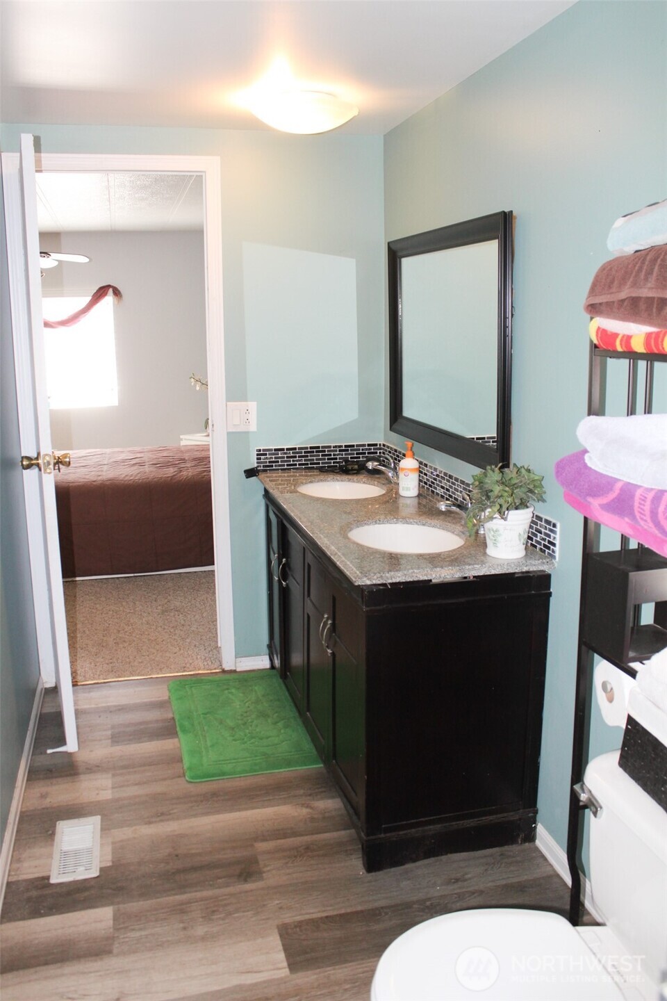 5705 Littlerock Road Southwest, Unit 41 Tumwater, WA 98512 - Photo 14 of 18 a bathroom with a sink a mirror and a bathtub