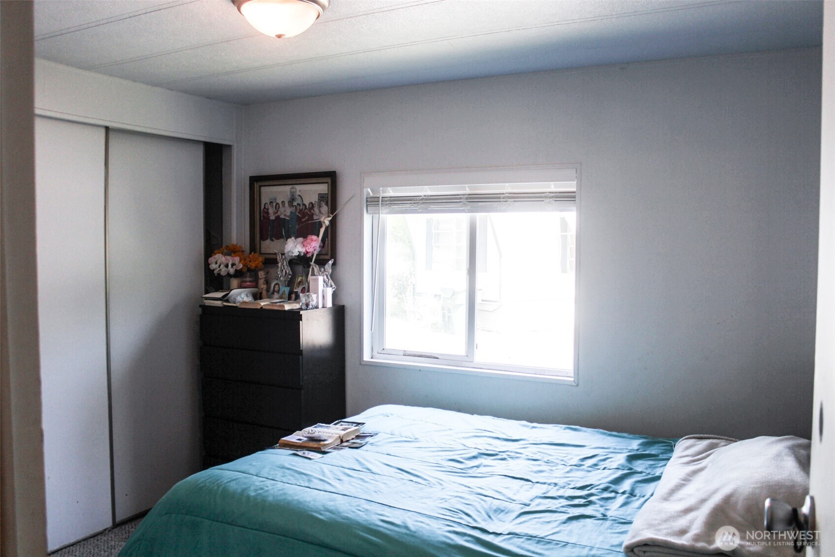 5705 Littlerock Road Southwest, Unit 41 Tumwater, WA 98512 - Photo 15 of 18 a bedroom with a bed and a window