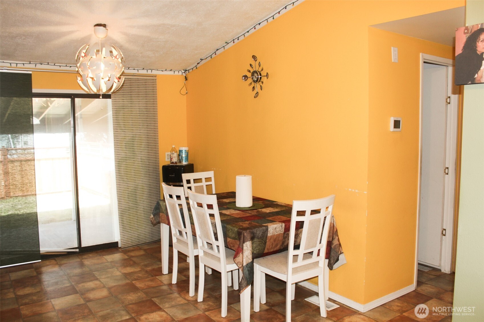 5705 Littlerock Road Southwest, Unit 41 Tumwater, WA 98512 - Photo 17 of 18 a view of a dining room with furniture and chandelier