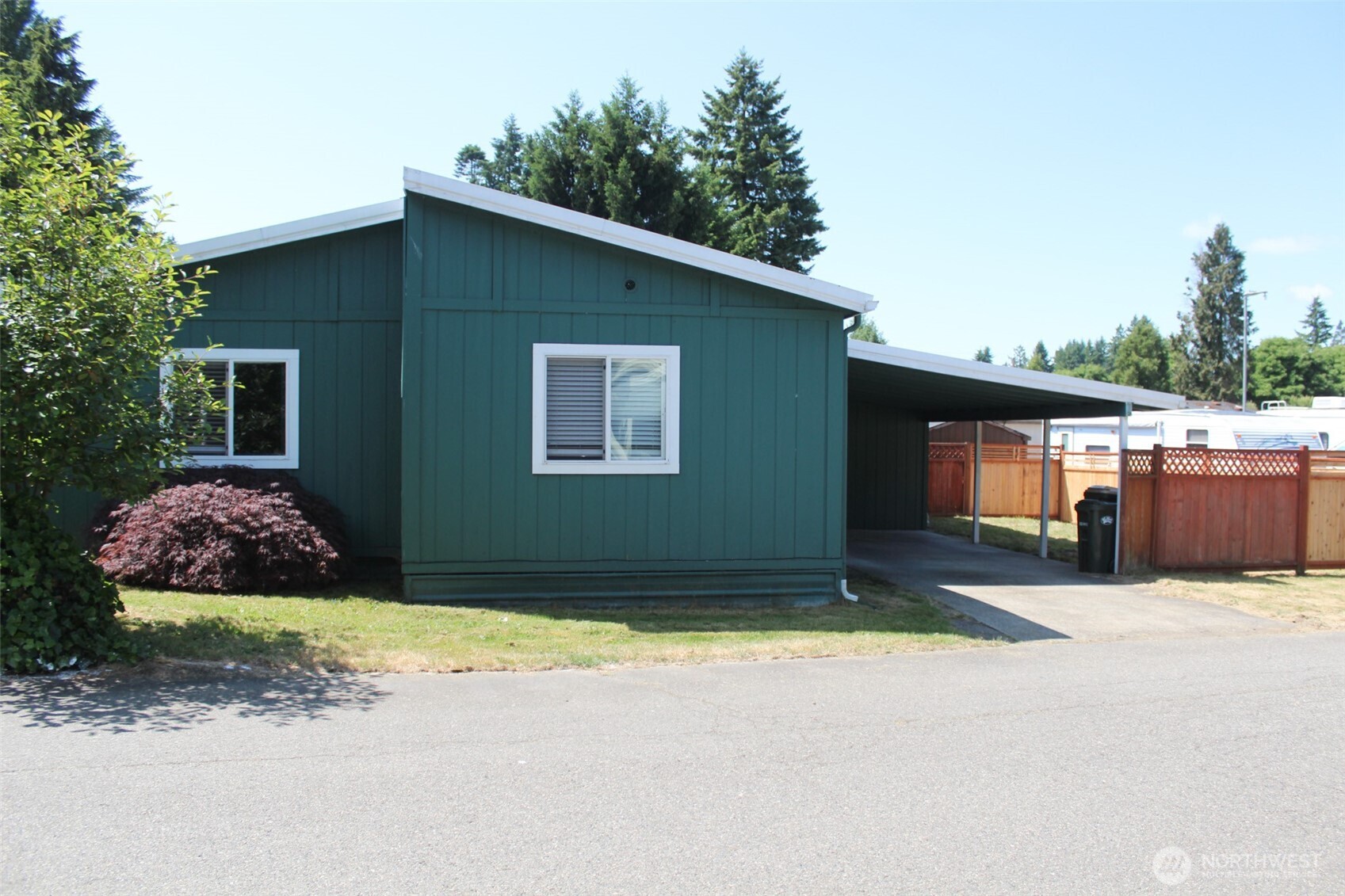 5705 Littlerock Road Southwest, Unit 41 Tumwater, WA 98512 - Photo 2 of 18 a view of a house with backyard and garden