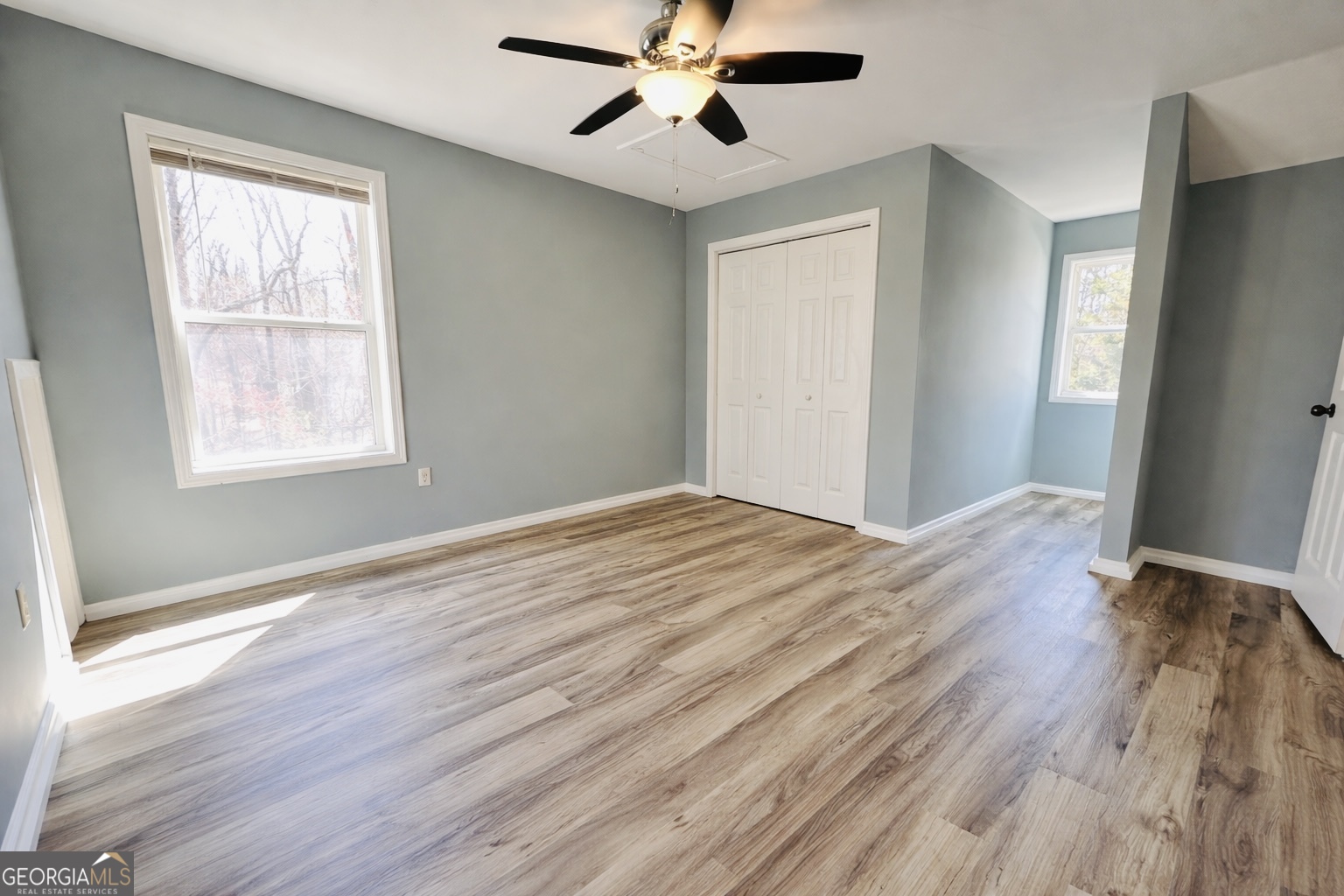 1947 Ivy Mountain Road Clarkesville, GA 30523 - Photo 17 of 31 a view of empty room with wooden floor and fan