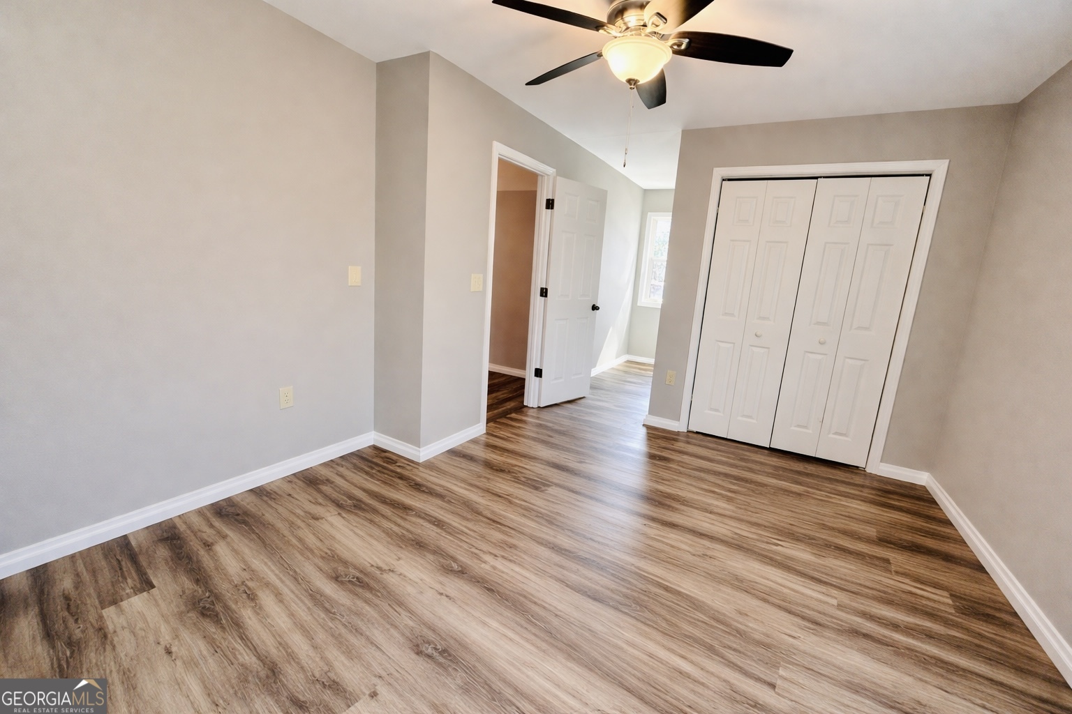 1947 Ivy Mountain Road Clarkesville, GA 30523 - Photo 19 of 31 wooden floor in an empty room with a window