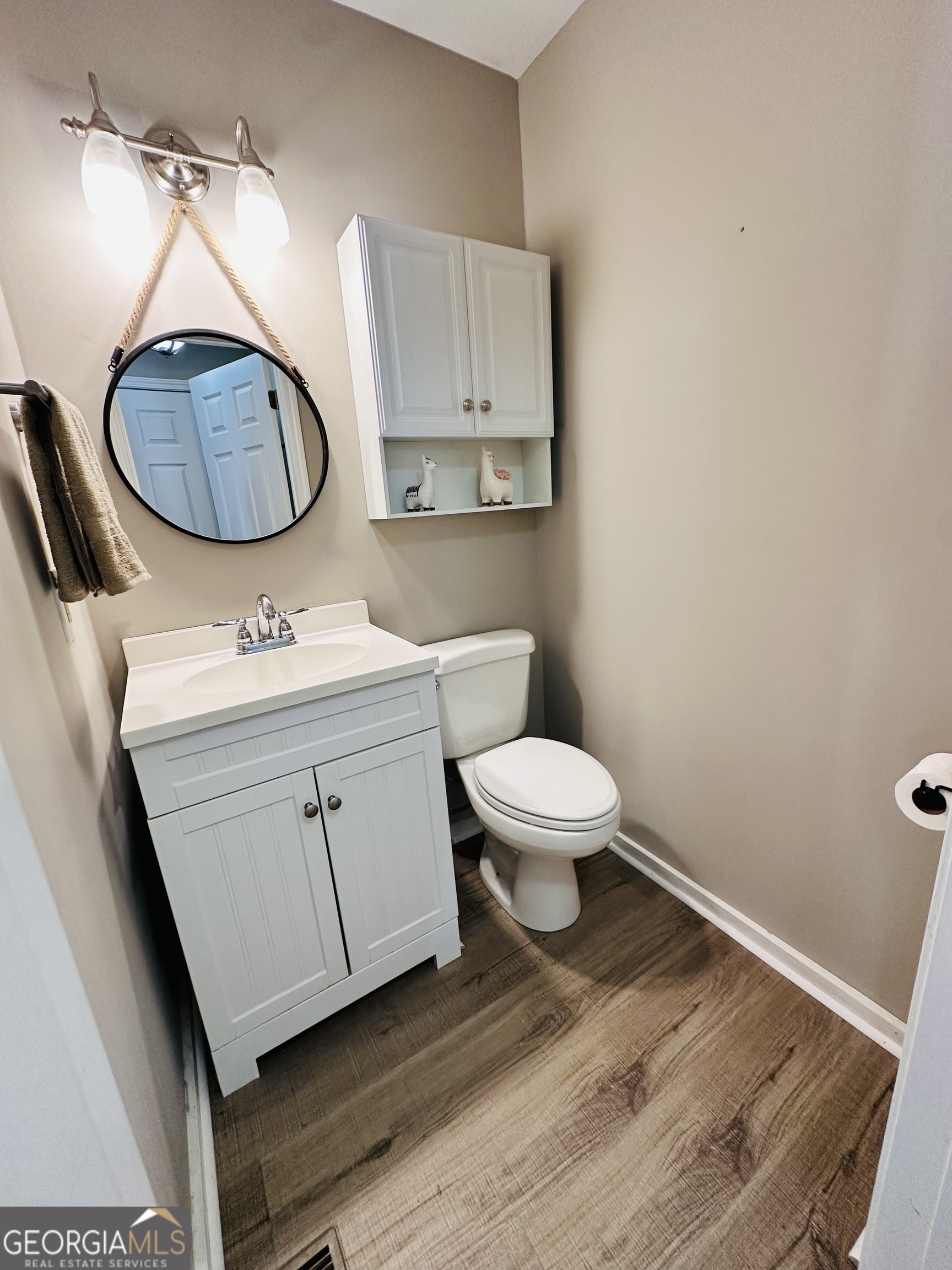 1947 Ivy Mountain Road Clarkesville, GA 30523 - Photo 5 of 31 a bathroom with a toilet a sink and mirror