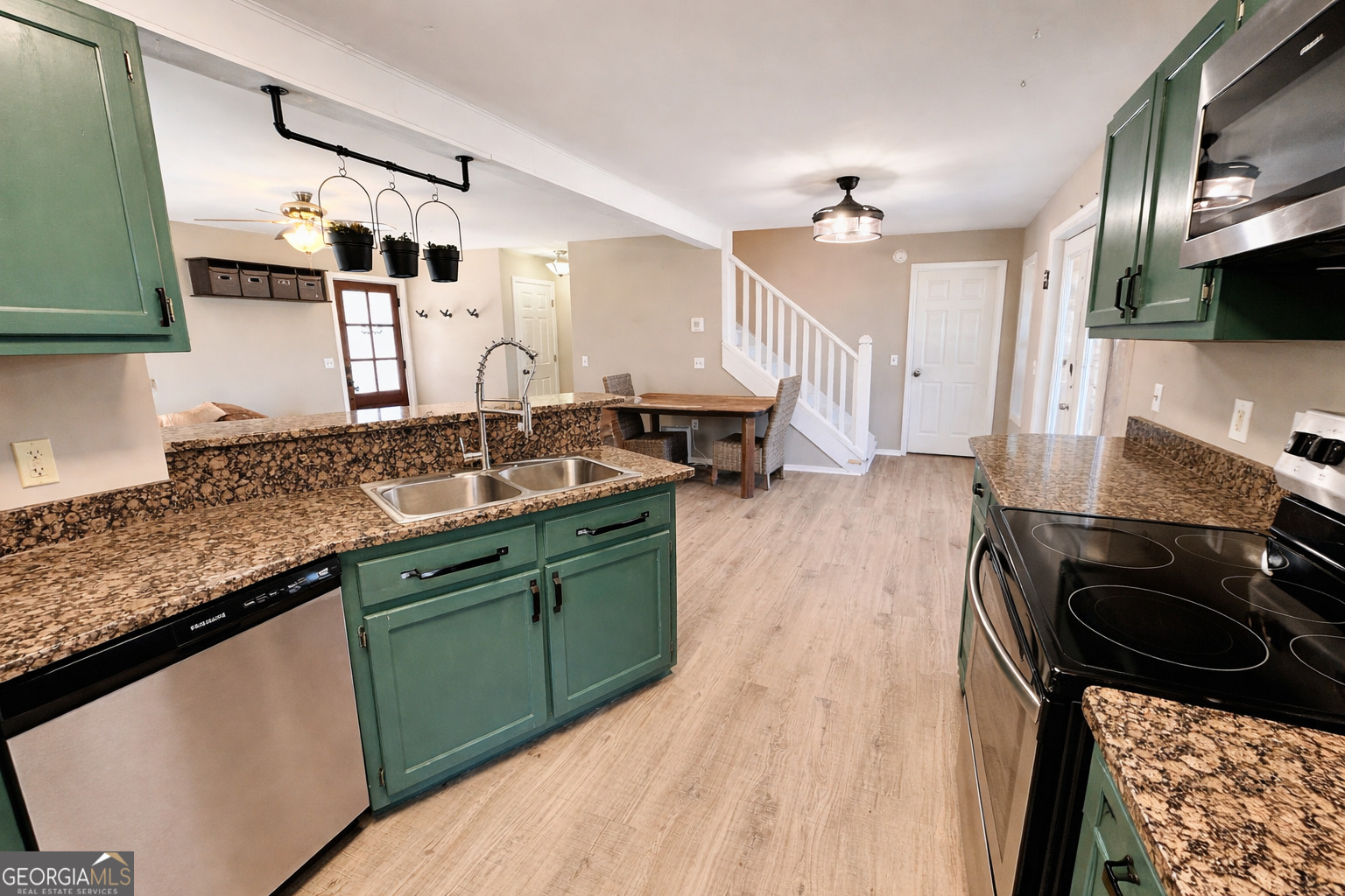 1947 Ivy Mountain Road Clarkesville, GA 30523 - Photo 6 of 31 a kitchen with granite countertop a sink stove and cabinets