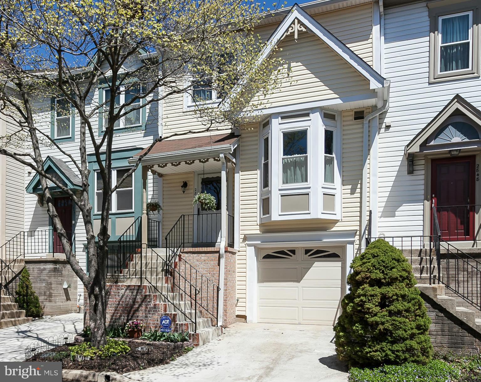 2846 Schoolhouse Circle Silver Spring, MD 20902 - Photo 1 of 28 a front view of a house with a yard