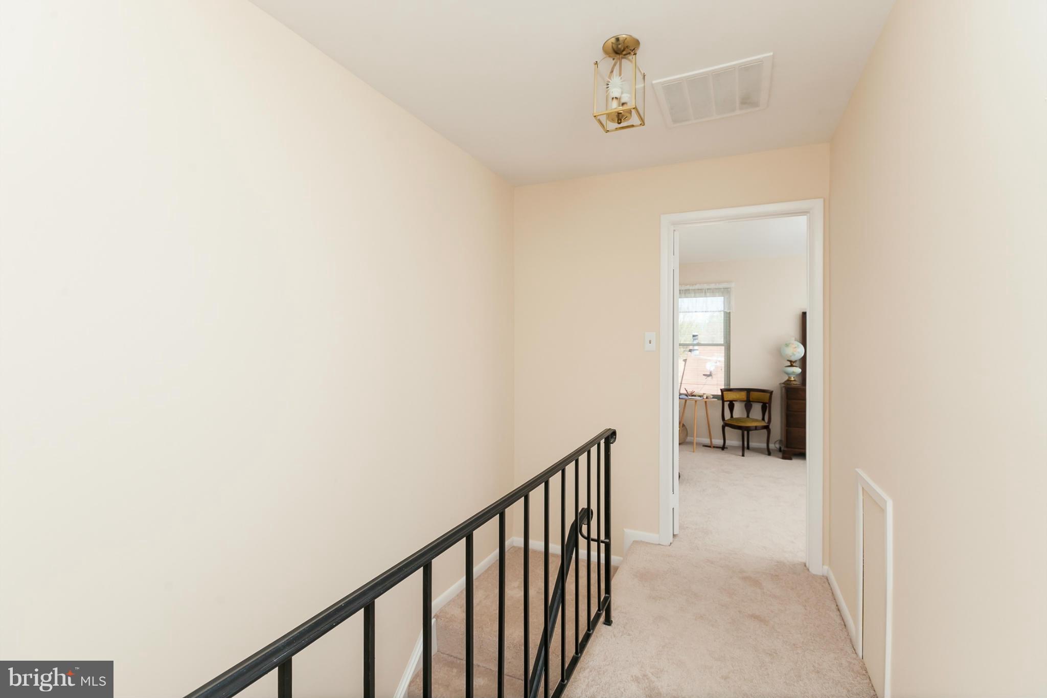 2846 Schoolhouse Circle Silver Spring, MD 20902 - Photo 14 of 28 a view of a hallway with a livingroom and a bathroom
