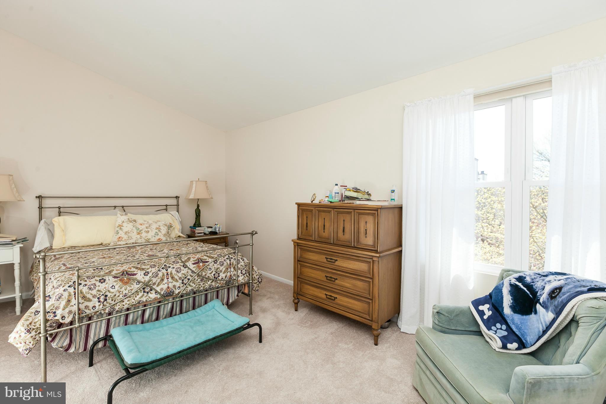 2846 Schoolhouse Circle Silver Spring, MD 20902 - Photo 15 of 28 a bedroom with a bed and a couch